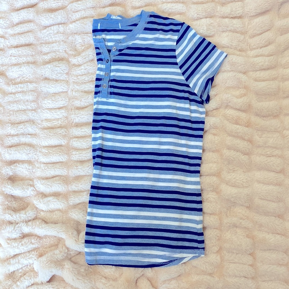 Blue striped short sleeve shirt with silver buttons.